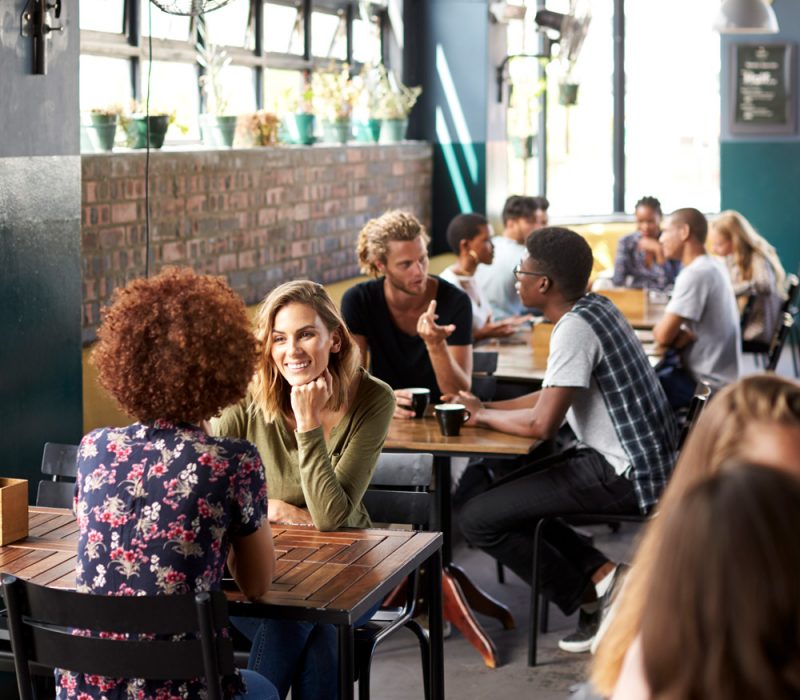 interior-of-busy-coffee-shop-with-customers-sittin-2021-08-26-16-14-53-utc